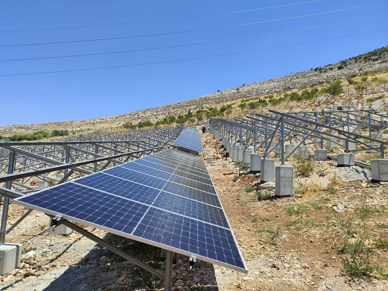 Rows of ground-mounted solar panels on a hillside: the 860 kWp solar water pumping system at Chamsine, Bekaa